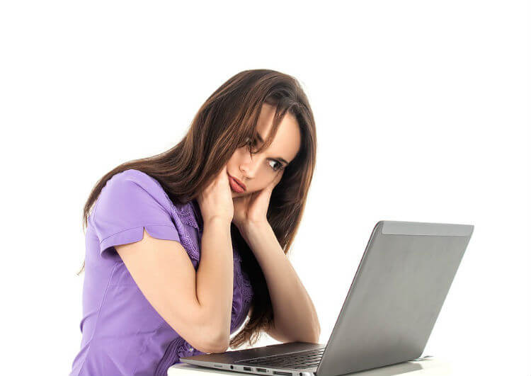 fatigued girl infront of computer